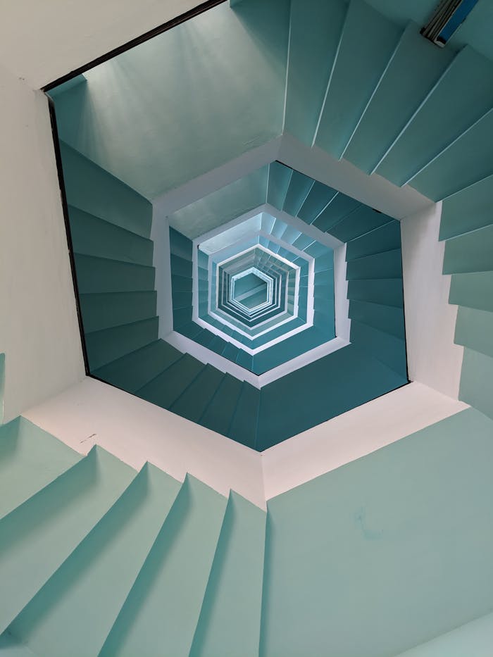 About Vertical view of a geometric stairwell with a blue pattern in Puducherry, India.